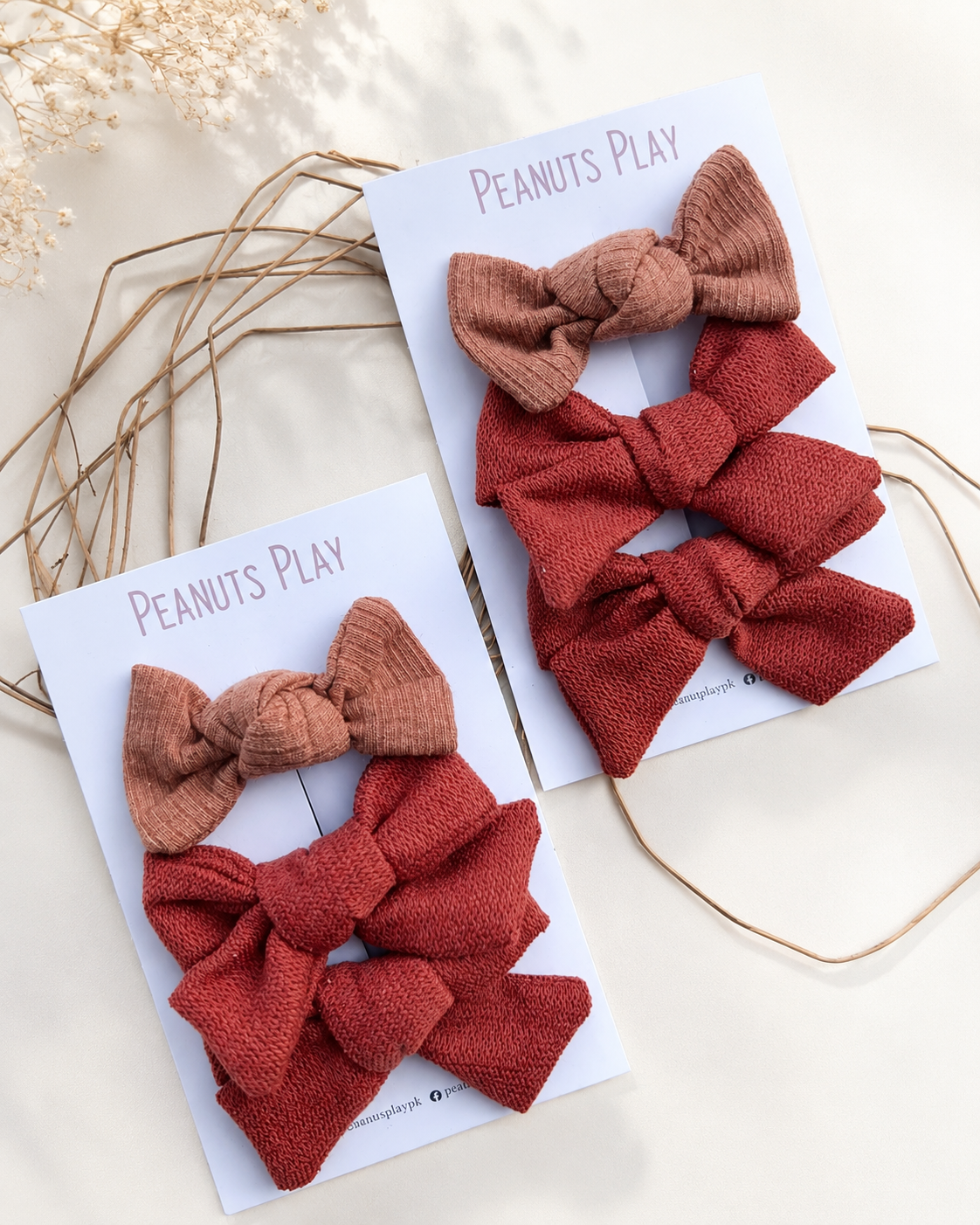 AD729F5D-7675-4B7D-827D-6660DCC55FA5 Woven Bow Hair Tie - Image 1