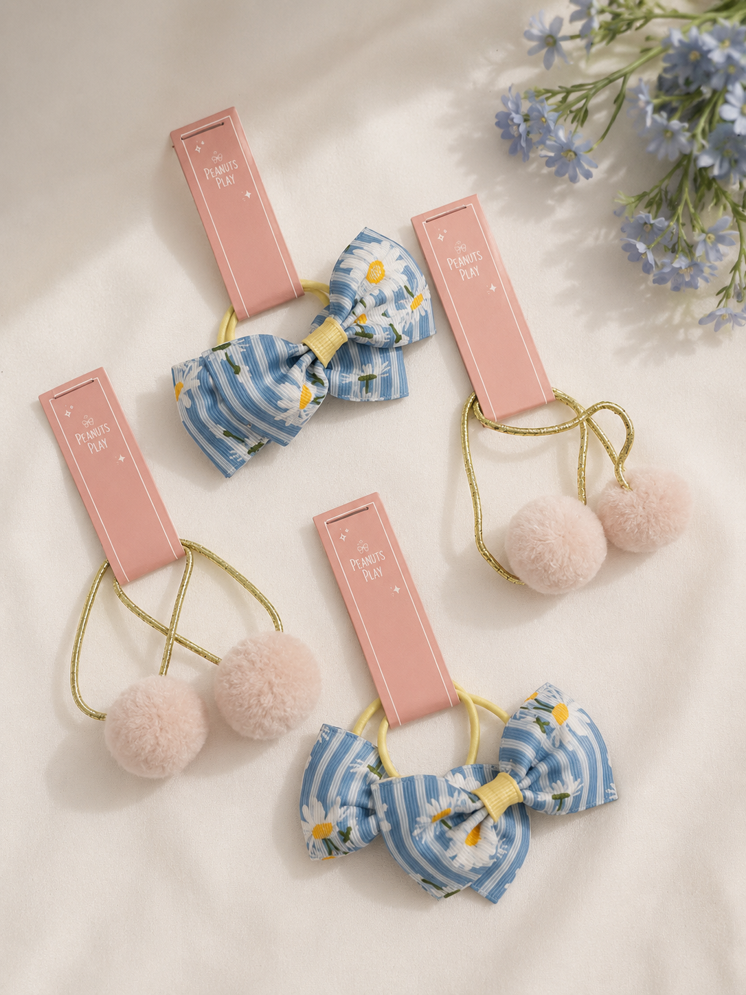 b Daisy Bow & Pom Pom Hair Tie - Image 1